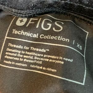 2 sets of figs scrubs for sale. Black and blue color; both size xs.